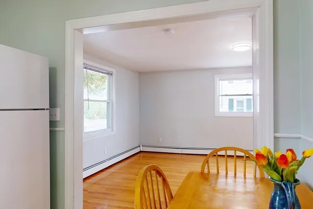 a bathroom with a sink mirror and toilet