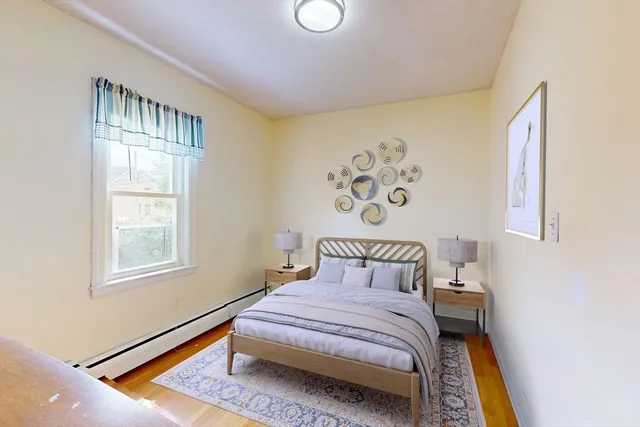 a view of a room with wooden floor and windows