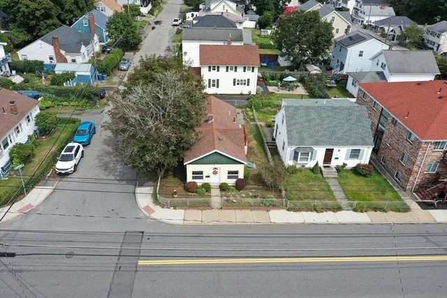 an aerial view of residential houses with outdoor space