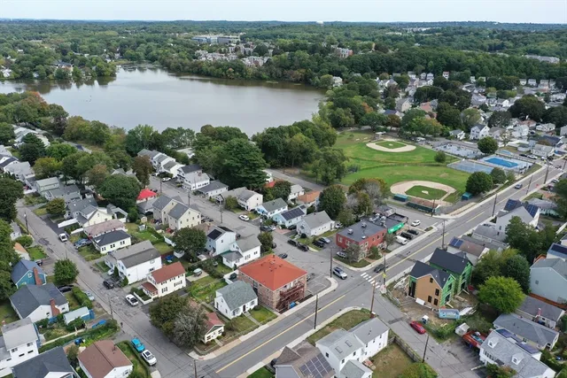 an aerial view of city and lake