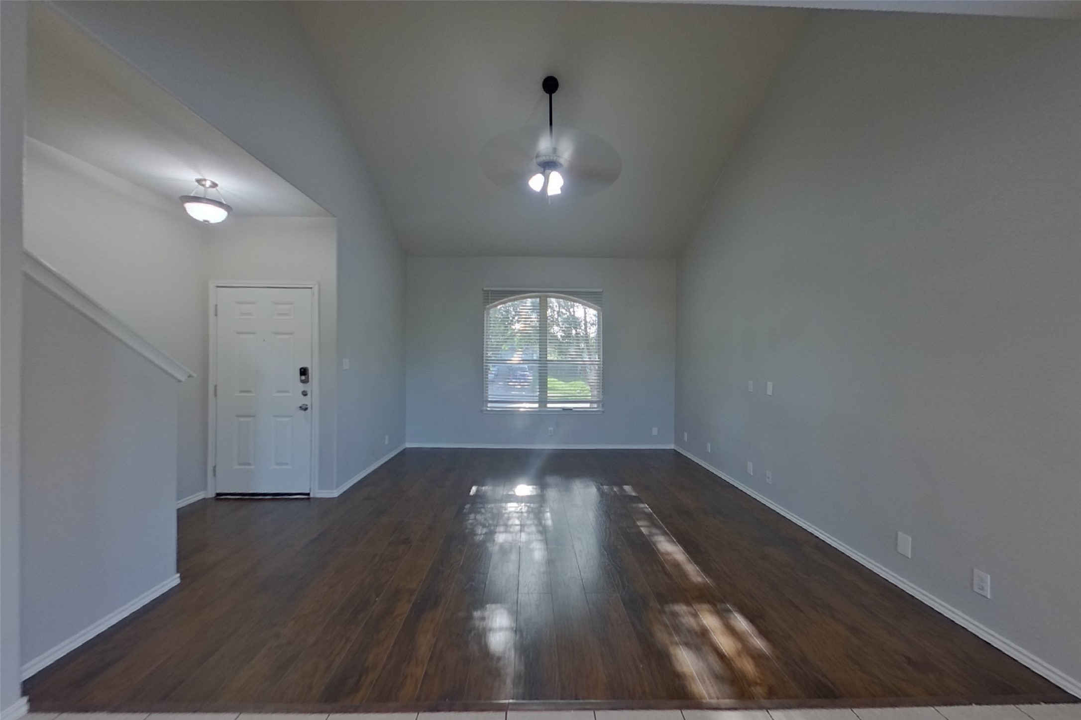 240 Dragon Ridge Road Buda, TX 78610 - Photo 2 of 20 Gleaming wood floors and high vaulted ceilings define this inviting main-level entry area.