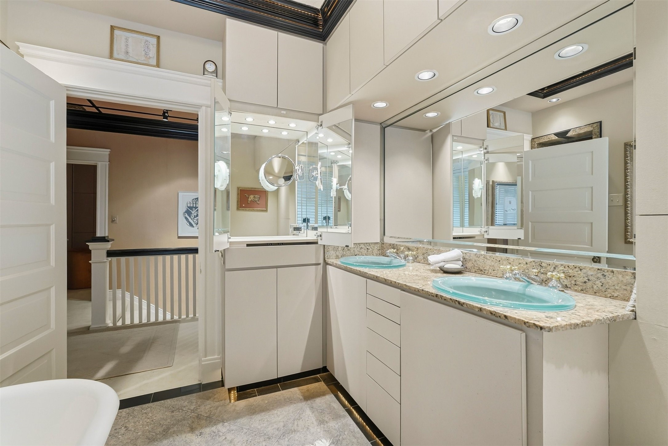 110 Stratford Street Houston, TX 77006 - Photo 26 of 40 a bathroom with a sink a large mirror and a shower