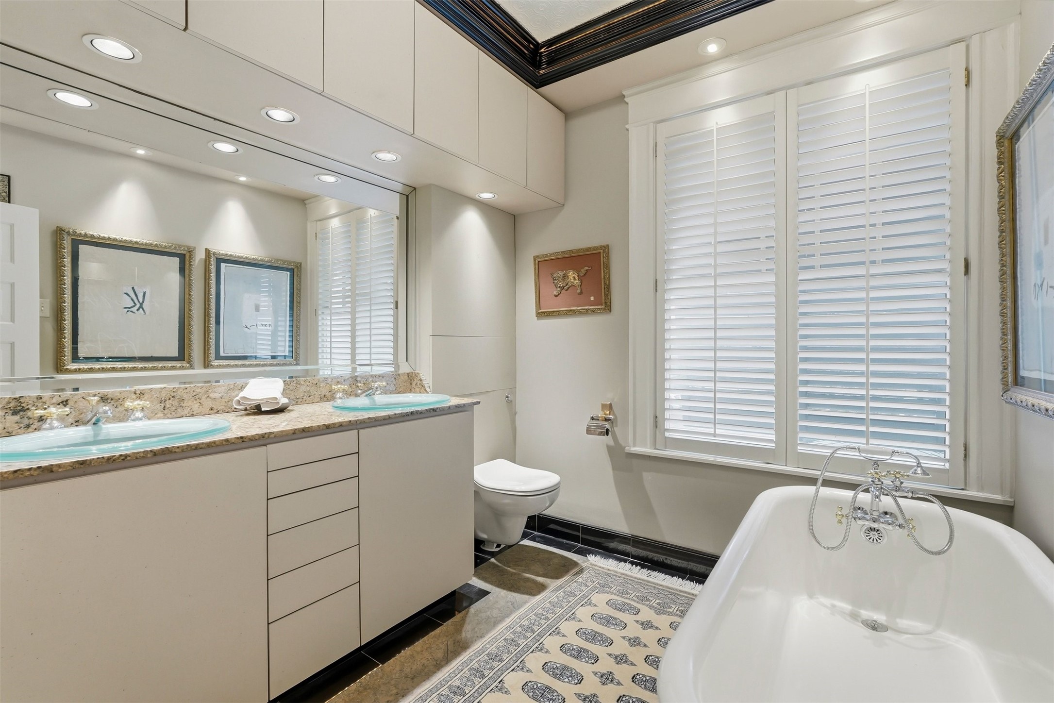 110 Stratford Street Houston, TX 77006 - Photo 27 of 40 a bathroom with a granite countertop sink mirror and a bathtub