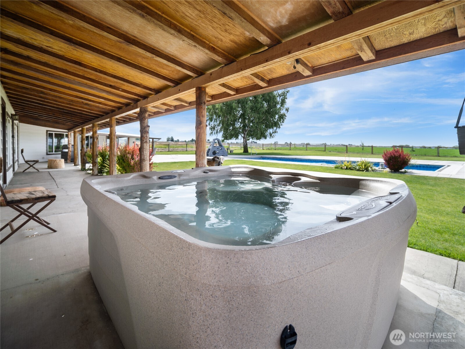 8708 Rd K Northeast Moses Lake, WA 98837 - Photo 15 of 40 a view of a swimming pool with a yard