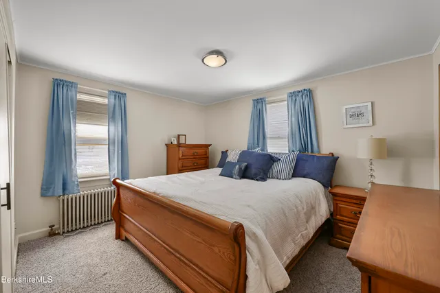 a bed room with a bed and a window