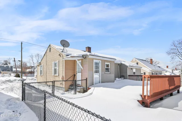 a front view of a house with a view of a roof deck