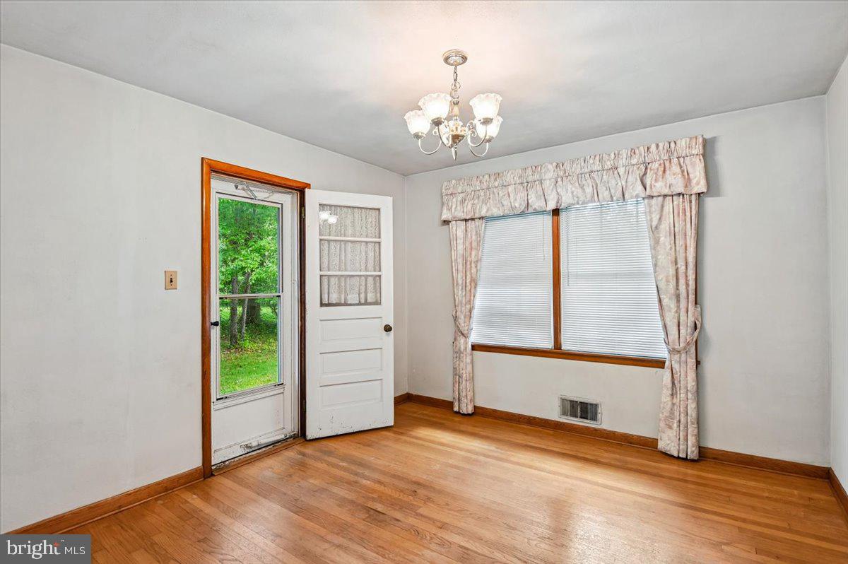 1509 Duvall Road Annapolis, MD 21409 - Photo 20 of 39 wooden floor in an empty room with a window