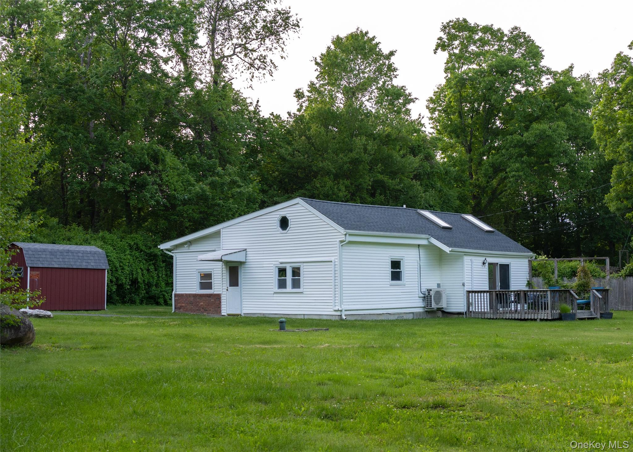 a front view of a house with a garden and porch