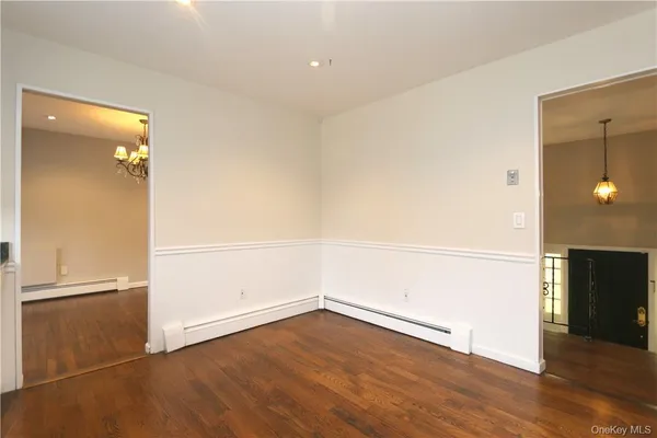an empty room with wooden floor