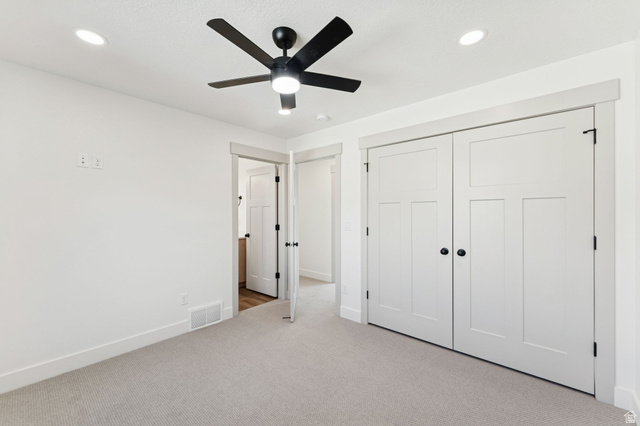 254 North Main Street Bountiful, UT 84010 - Photo 17 of 45 Unfurnished bedroom with carpet floors, recessed lighting, a closet, and ceiling fan