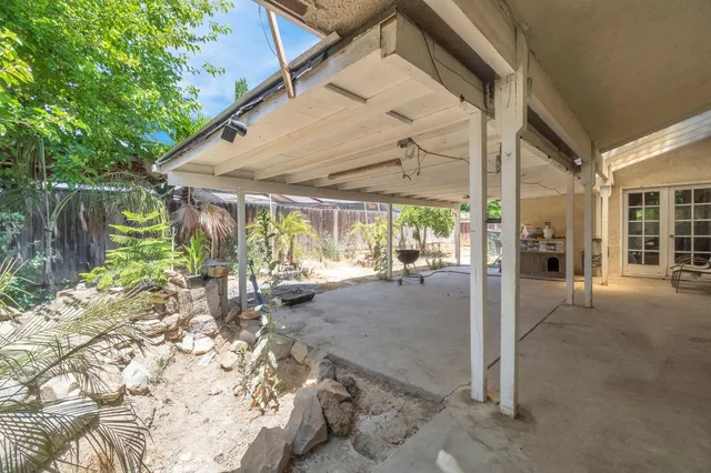 a view of a house with backyard from a patio