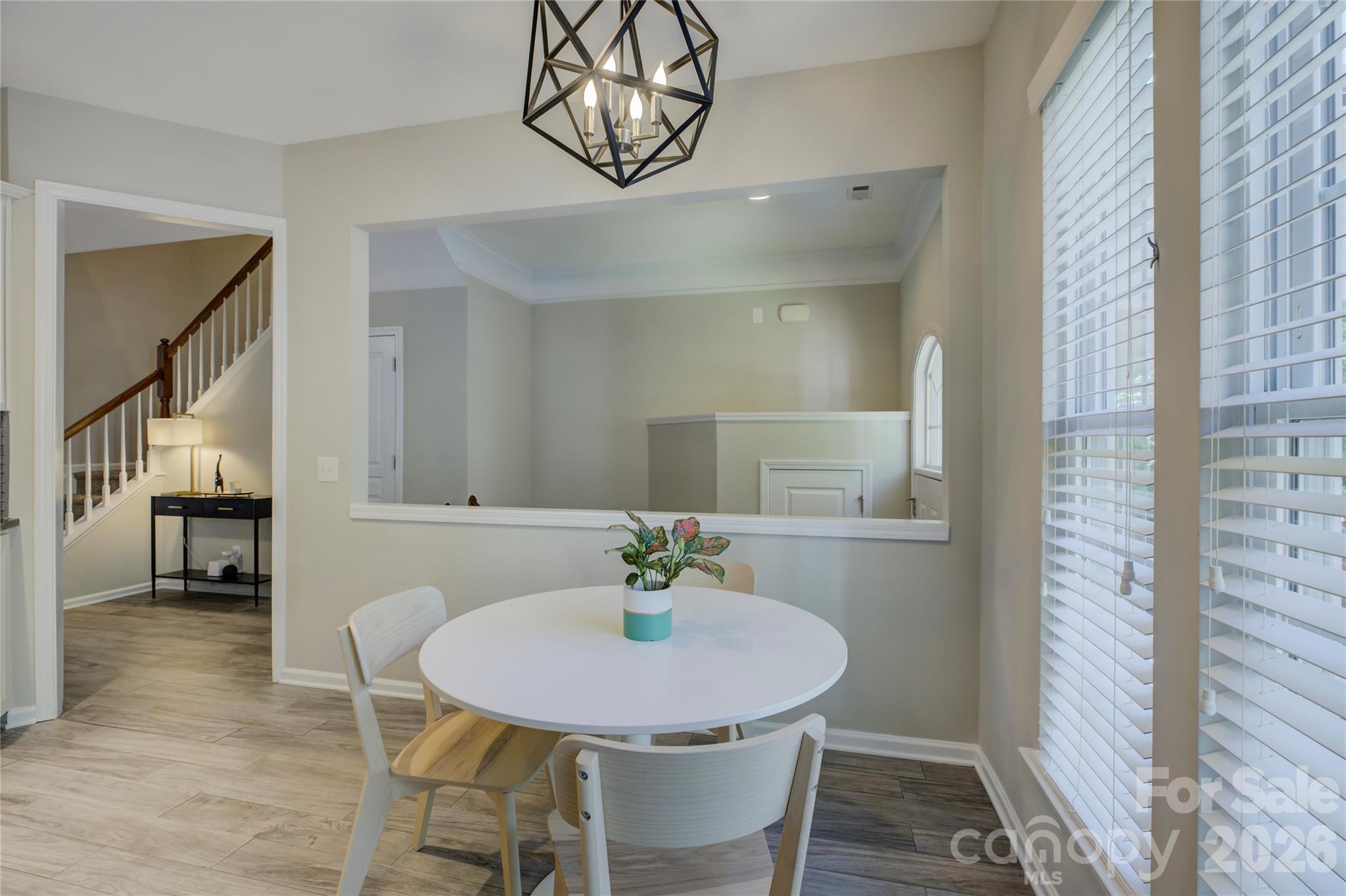 629 6th Baxter Crossing Fort Mill, SC 29708 - Photo 11 of 48 a view of a dining room with furniture and wooden floor