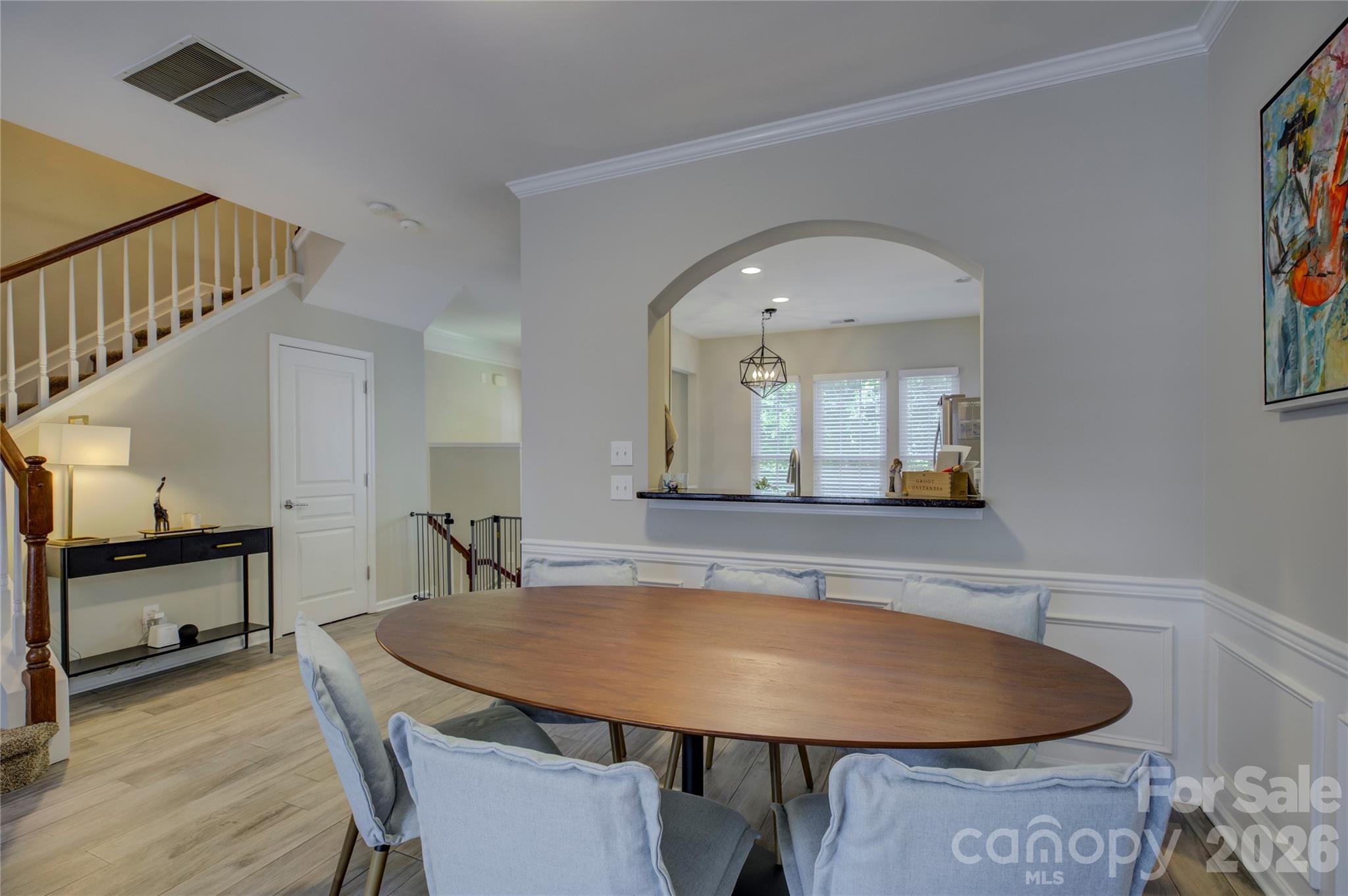629 6th Baxter Crossing Fort Mill, SC 29708 - Photo 13 of 48 a view of a dining room with furniture and wooden floor