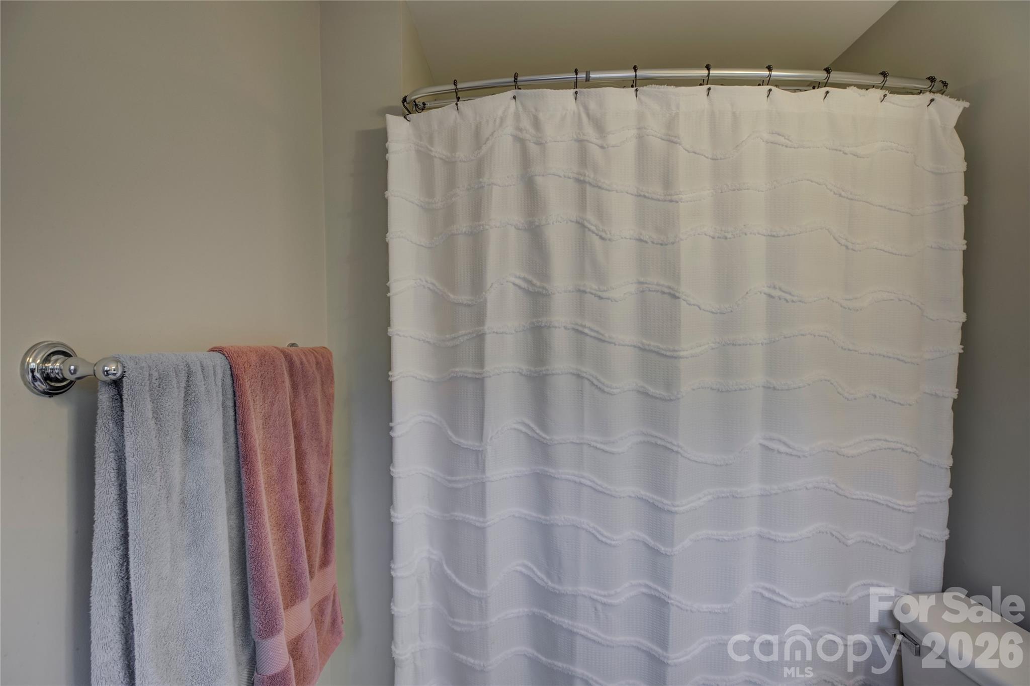 629 6th Baxter Crossing Fort Mill, SC 29708 - Photo 27 of 48 a bathroom with a shower curtain and a curtain