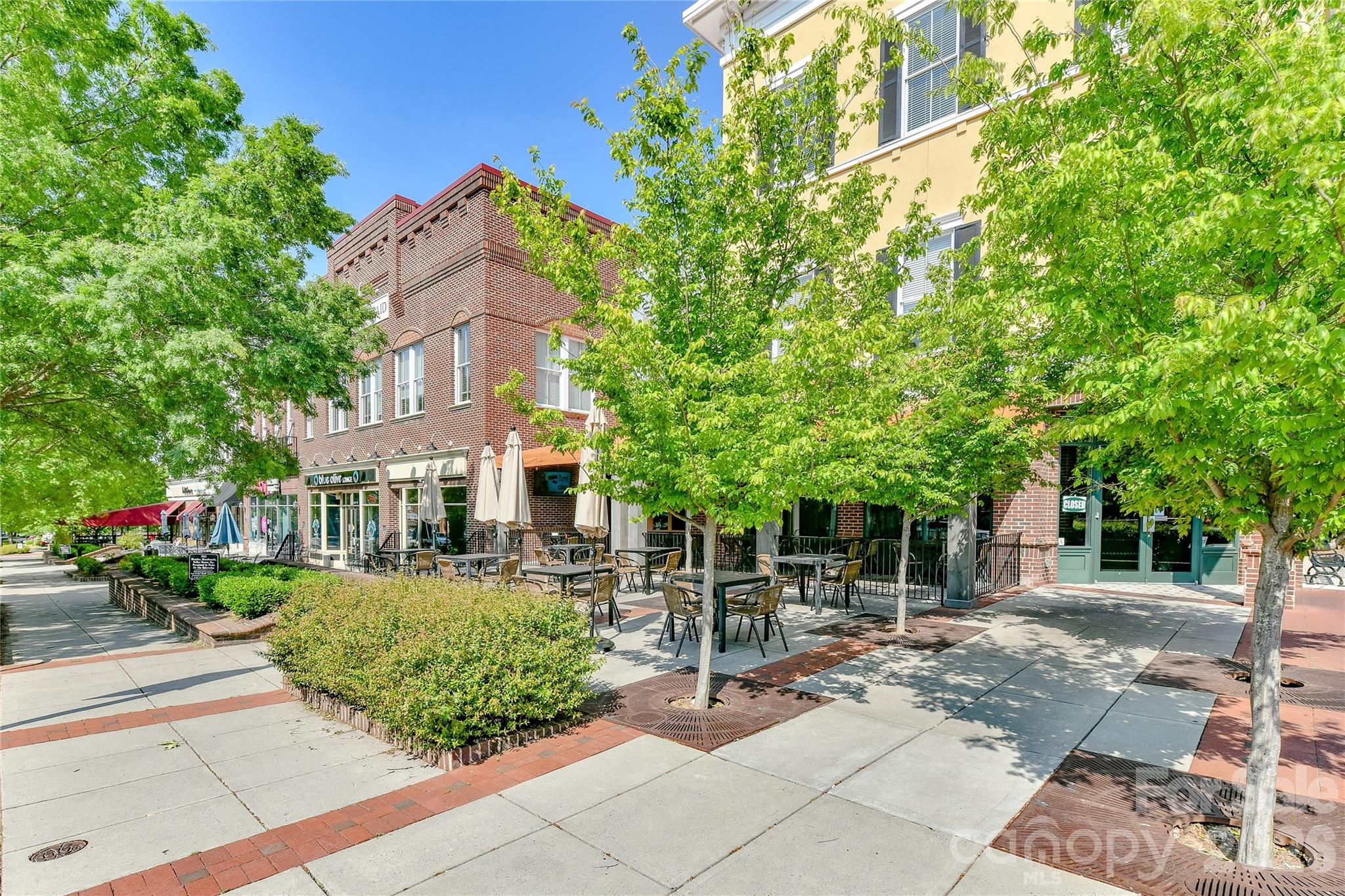629 6th Baxter Crossing Fort Mill, SC 29708 - Photo 45 of 48 a view of a patio with table and chairs and potted plants