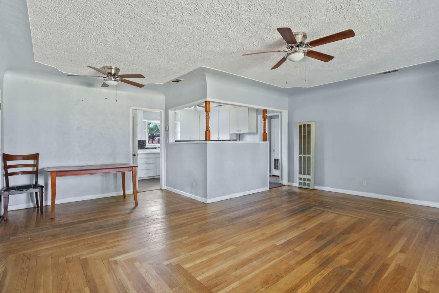 916 Elm Avenue Modesto, CA 95351 - Photo 11 of 52 12. Living room looking toward kitchen The living space opens easily toward the kitchen, giving the home a practical flow with vintage charm still very much in the room.
