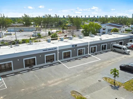 a view of a patio with a table and chairs
