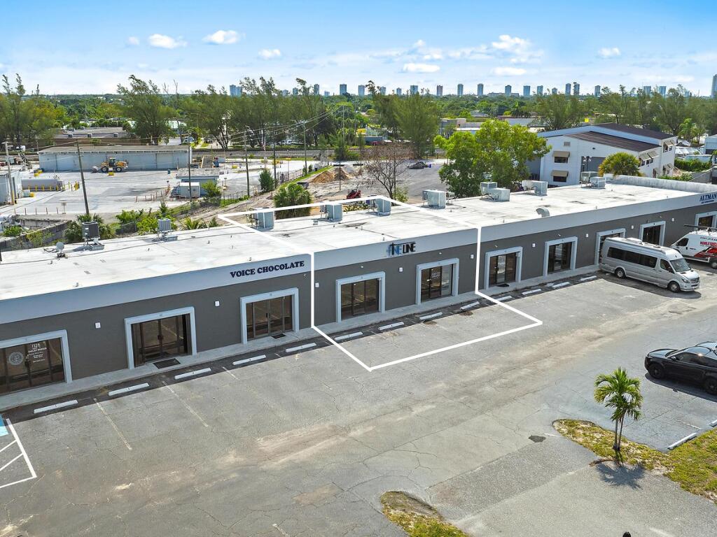 1125 Old Dixie Highway, Unit 4&5 Lake Park, FL 33403 - Photo 1 of 32 a view of a patio with a table and chairs
