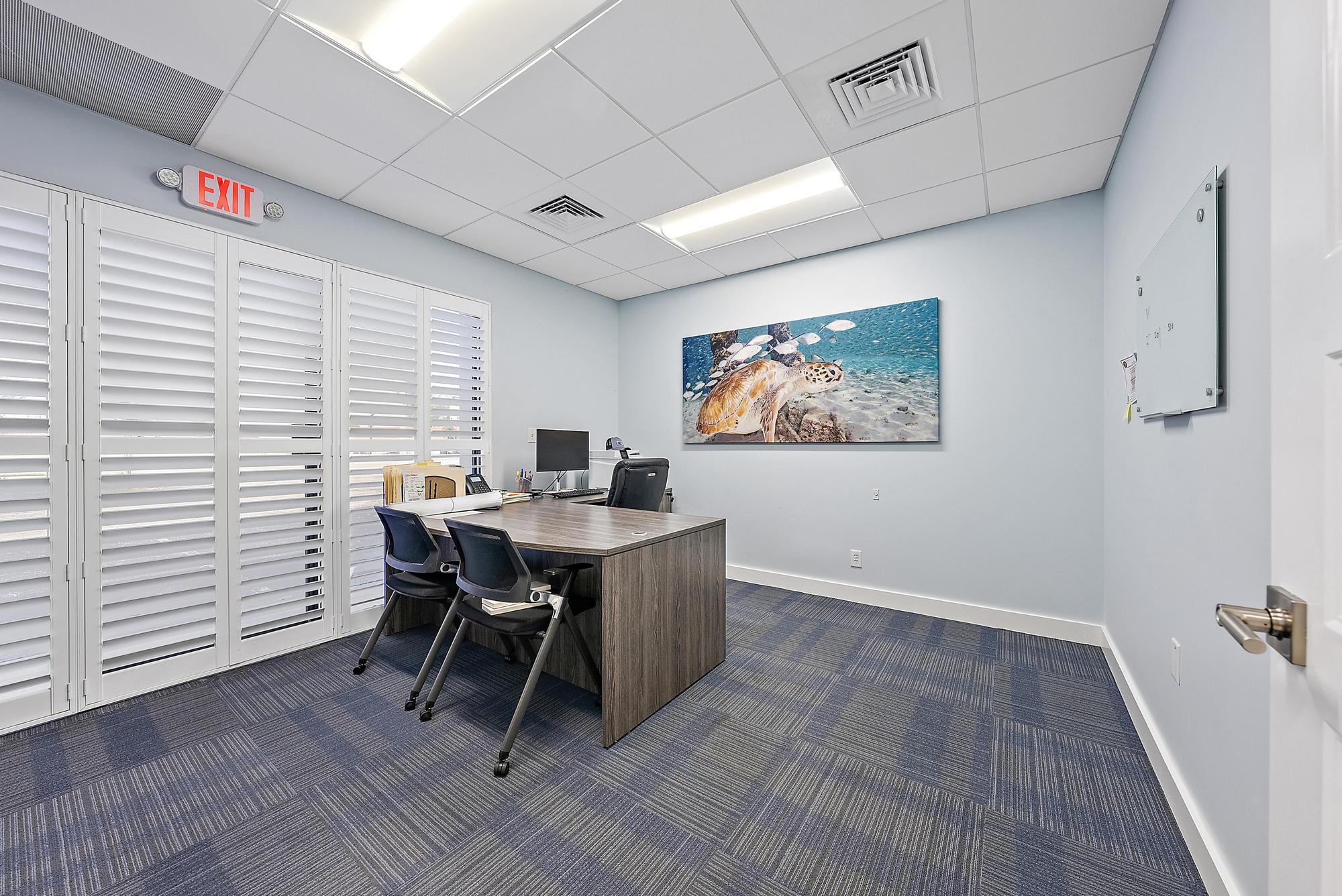 1125 Old Dixie Highway, Unit 4&5 Lake Park, FL 33403 - Photo 11 of 32 a workspace with furniture and window