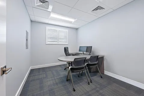 a workspace with furniture and window