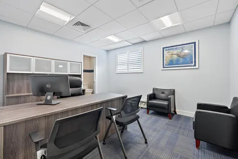 a bathroom with a sink a mirror and shower