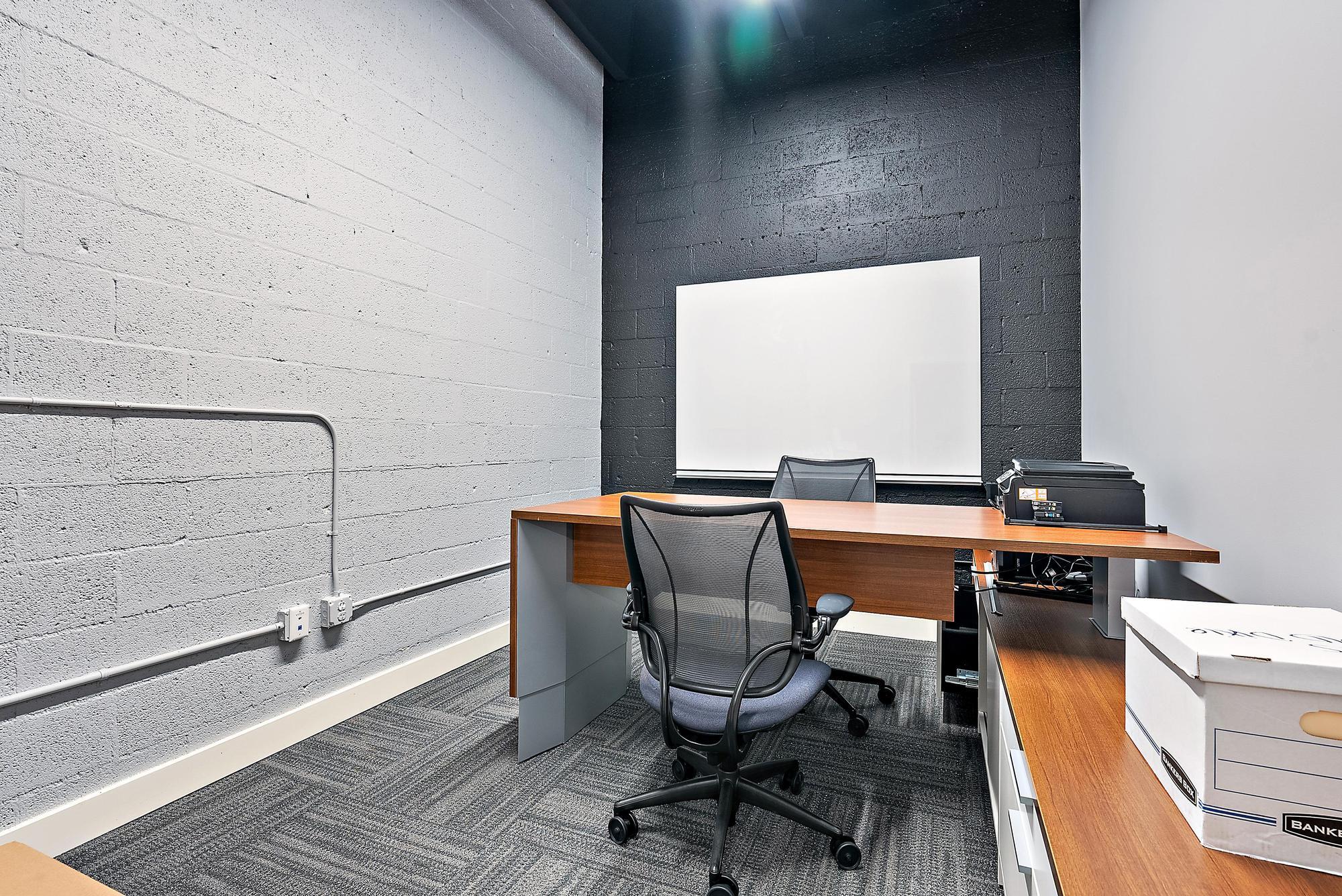 1125 Old Dixie Highway, Unit 4&5 Lake Park, FL 33403 - Photo 23 of 32 a room with a table and chairs