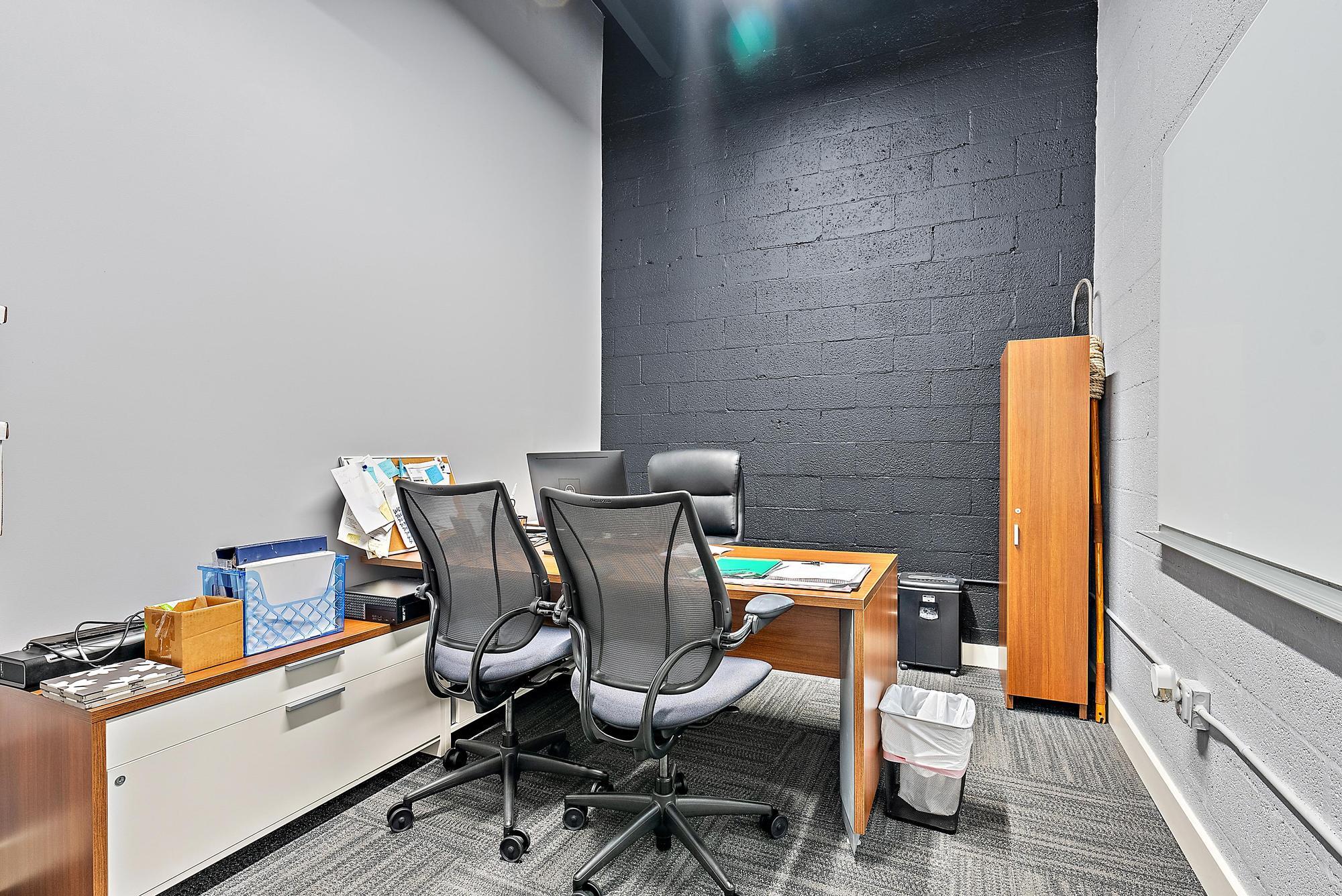 1125 Old Dixie Highway, Unit 4&5 Lake Park, FL 33403 - Photo 24 of 32 a view of a workspace with furniture and wooden floor