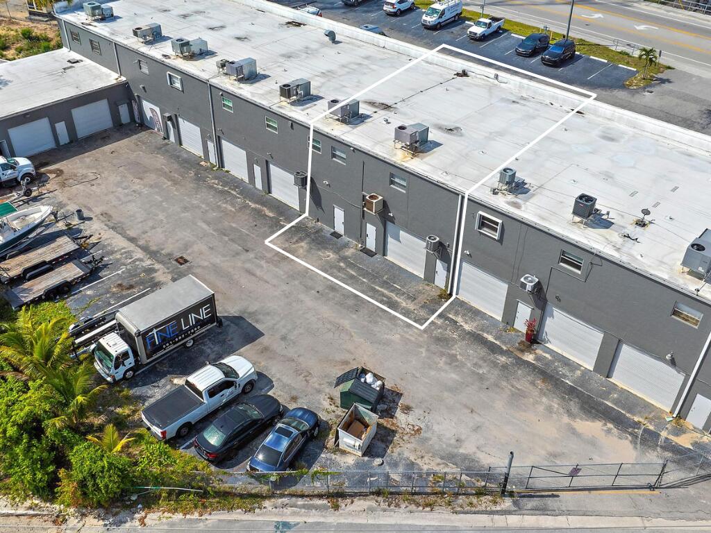 1125 Old Dixie Highway, Unit 4&5 Lake Park, FL 33403 - Photo 30 of 32 a view of a terrace with wooden floor