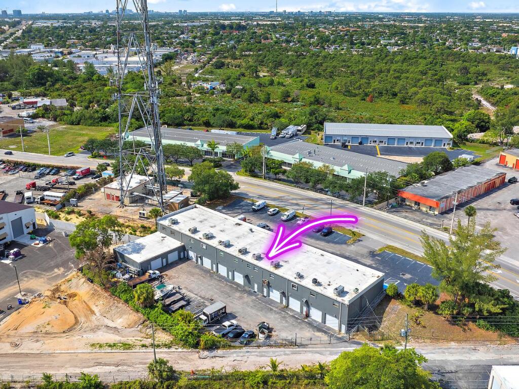 1125 Old Dixie Highway, Unit 4&5 Lake Park, FL 33403 - Photo 31 of 32 an aerial view of residential houses with outdoor space and street view