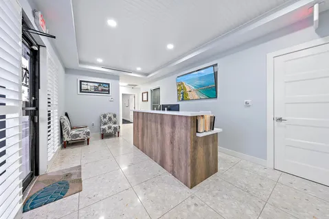 a view of a livingroom with furniture and cabinet