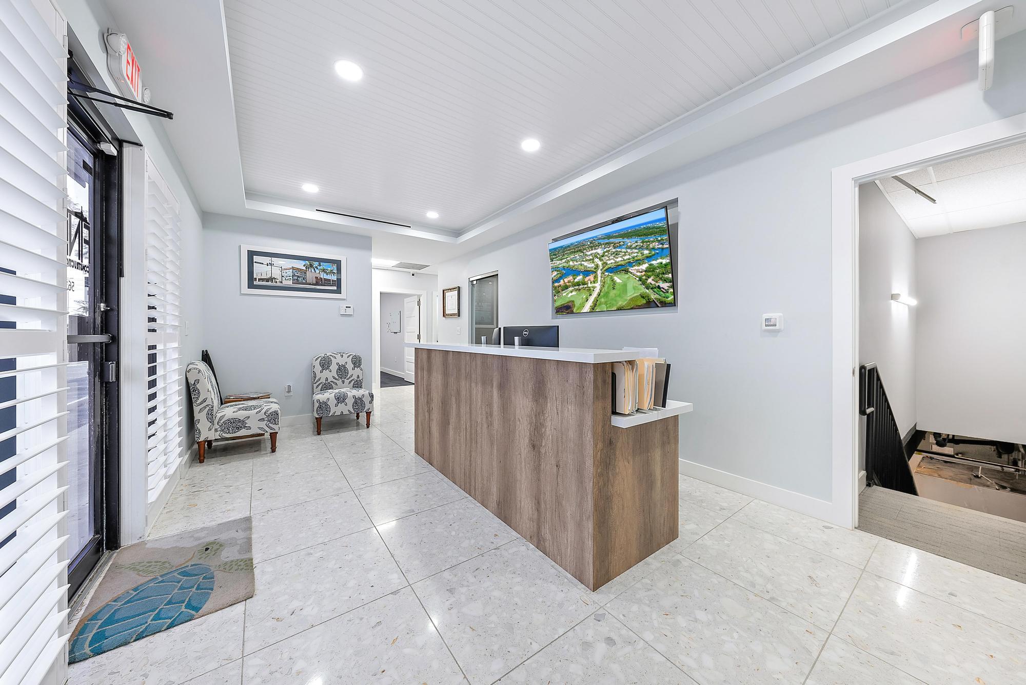 1125 Old Dixie Highway, Unit 4&5 Lake Park, FL 33403 - Photo 6 of 32 a living room with furniture and a flat screen tv