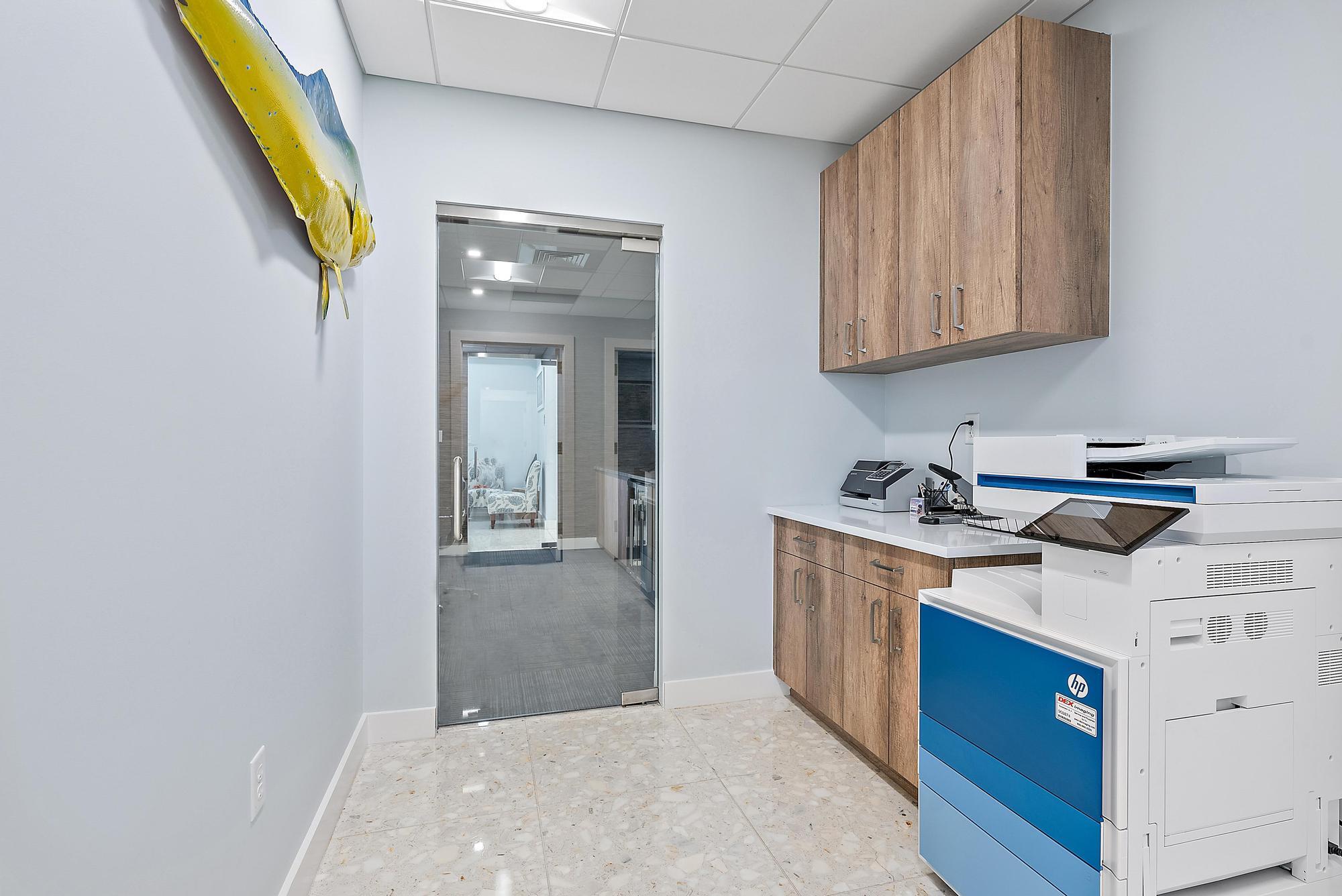 1125 Old Dixie Highway, Unit 4&5 Lake Park, FL 33403 - Photo 9 of 32 a kitchen with stainless steel appliances granite countertop a stove and a sink