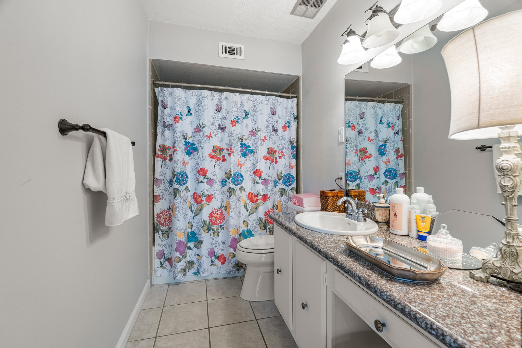 355 North Post Oak Lane, Unit 742 Houston, TX 77024 - Photo 13 of 18 a bathroom with a sink a vanity and a shower curtain