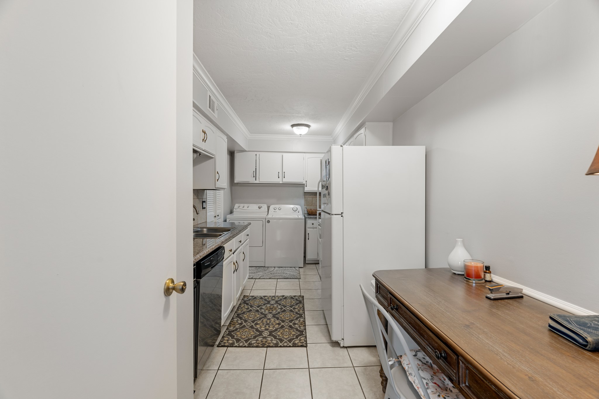 355 North Post Oak Lane, Unit 742 Houston, TX 77024 - Photo 14 of 18 a kitchen with a sink appliances and cabinets