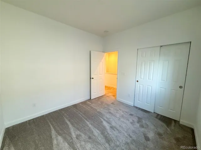 an empty room with a bathroom