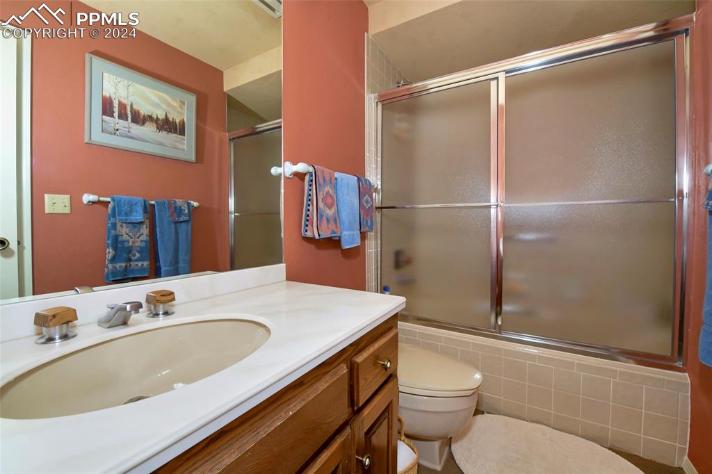 3130 Camels Ridge Lane Colorado Springs, CO 80904 - Photo 12 of 35 a bathroom with a sink toilet and shower