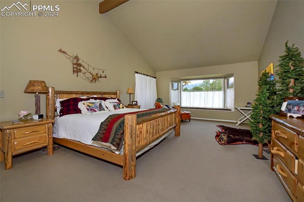 3130 Camels Ridge Lane Colorado Springs, CO 80904 - Photo 13 of 35 a bedroom with a bed and a window