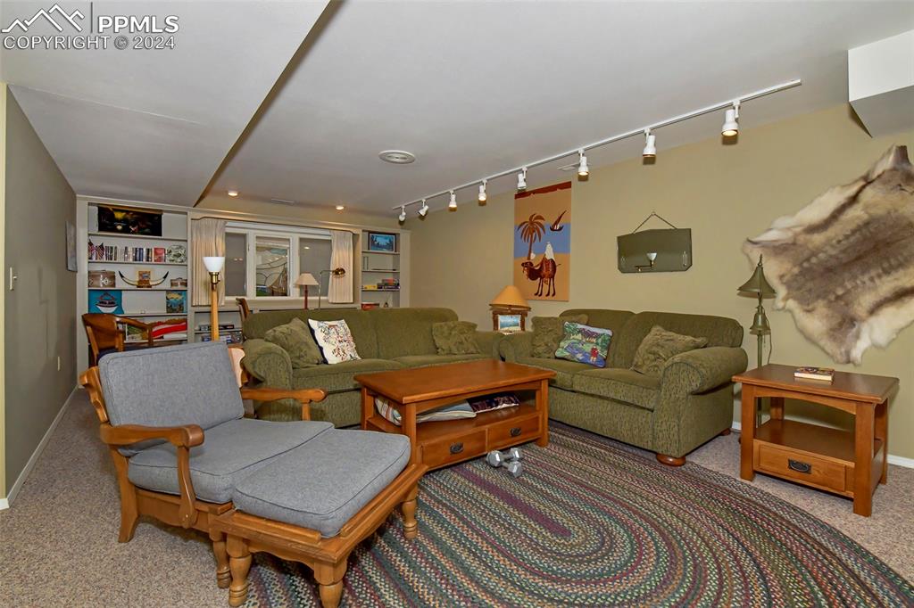 3130 Camels Ridge Lane Colorado Springs, CO 80904 - Photo 19 of 35 a living room with furniture and a rug