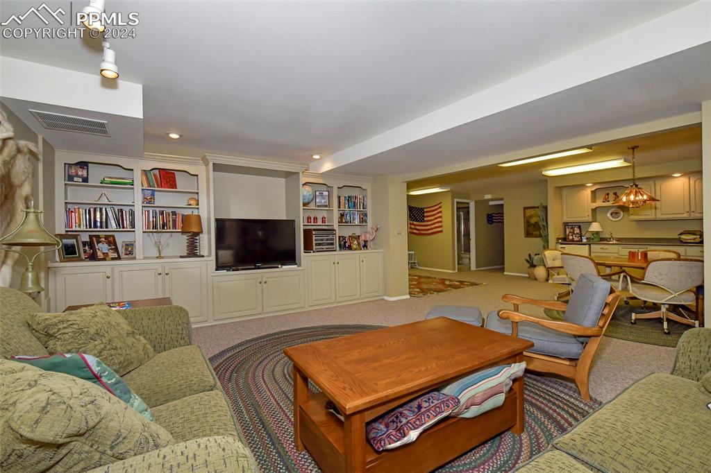 3130 Camels Ridge Lane Colorado Springs, CO 80904 - Photo 21 of 35 a living room with furniture and a flat screen tv