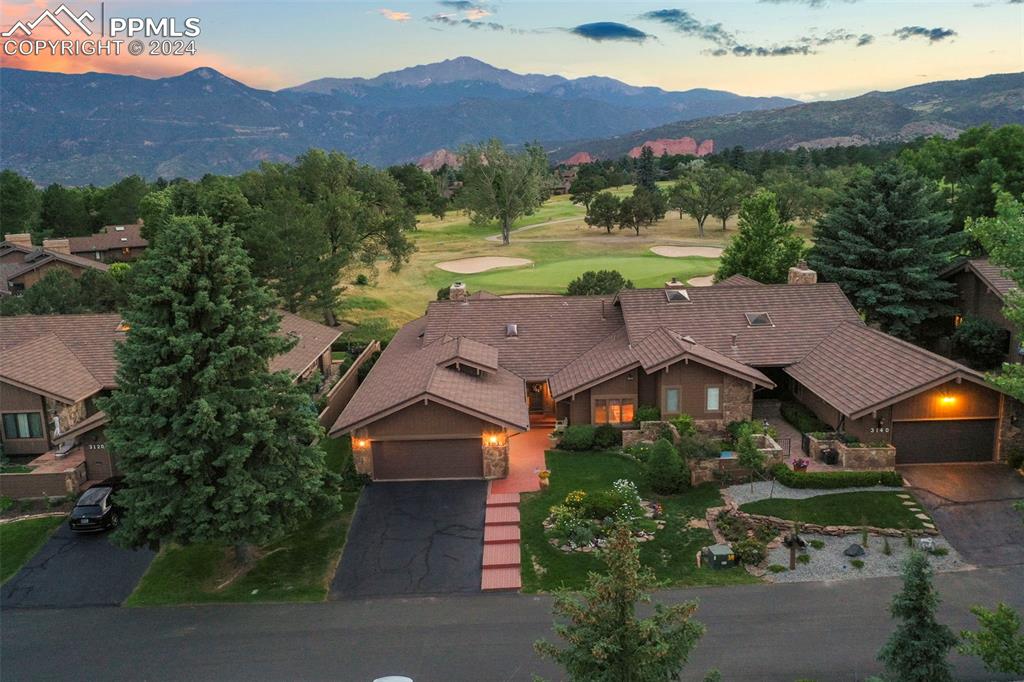 3130 Camels Ridge Lane Colorado Springs, CO 80904 - Photo 32 of 35 an aerial view of a house with an outdoor space and street view