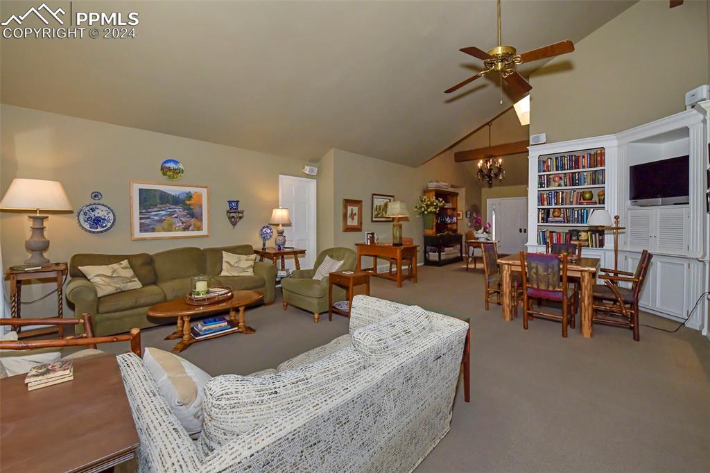 3130 Camels Ridge Lane Colorado Springs, CO 80904 - Photo 5 of 35 a living room with furniture and a flat screen tv