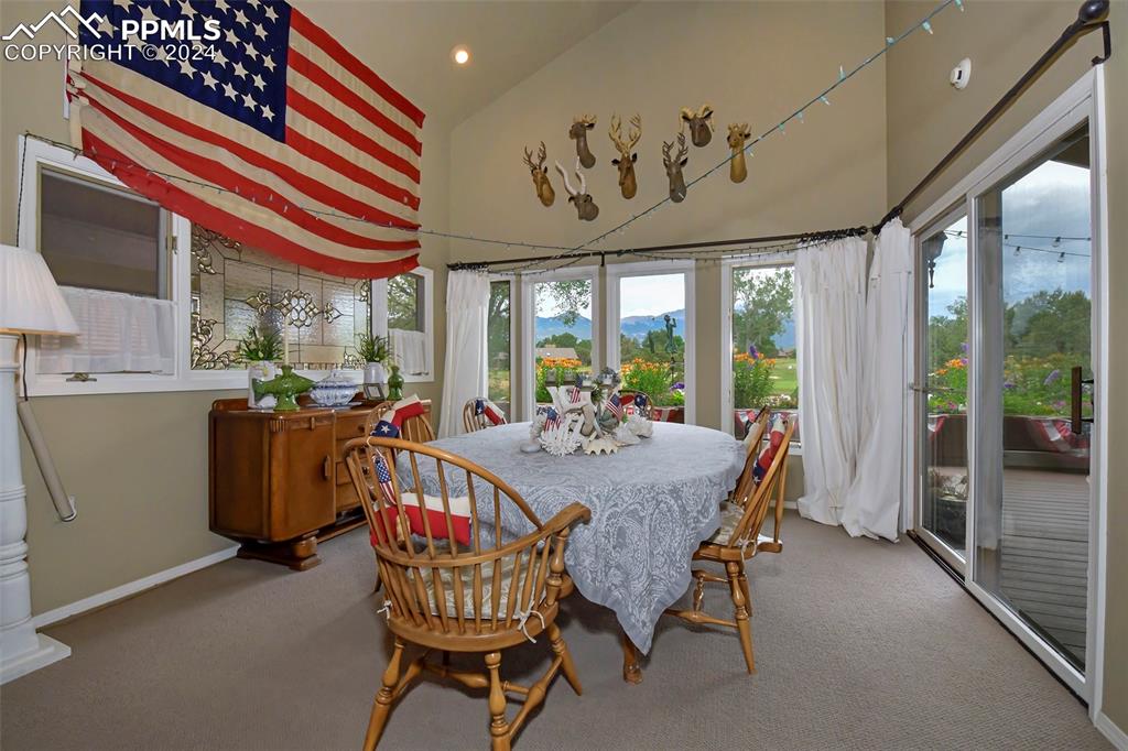 3130 Camels Ridge Lane Colorado Springs, CO 80904 - Photo 10 of 35 a view of a dining room with furniture window and outside view