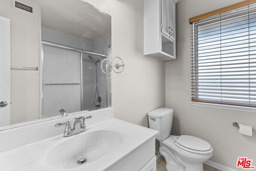 186 Southampton Way, Unit 29 Placentia, CA 92870 - Photo 14 of 20 a bathroom with a sink toilet and shower
