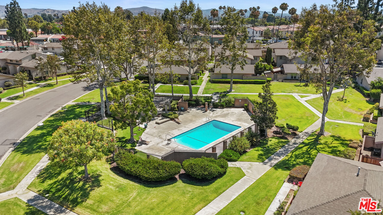 186 Southampton Way, Unit 29 Placentia, CA 92870 - Photo 16 of 20 an aerial view of a house with a garden and swimming pool