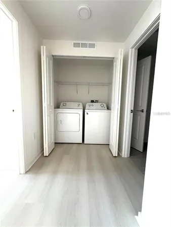 a view of a kitchen with a sink and dishwasher