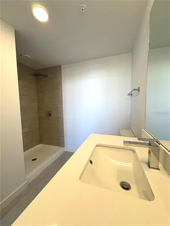 a bathroom with a tub and shower