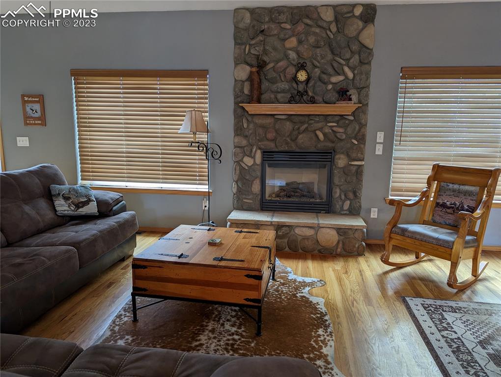 238 Aspen Circle Divide, CO 80814 - Photo 21 of 42 a living room with furniture and a fireplace