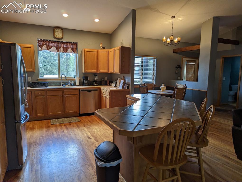238 Aspen Circle Divide, CO 80814 - Photo 24 of 42 a view of a dining room with furniture window and wooden floor