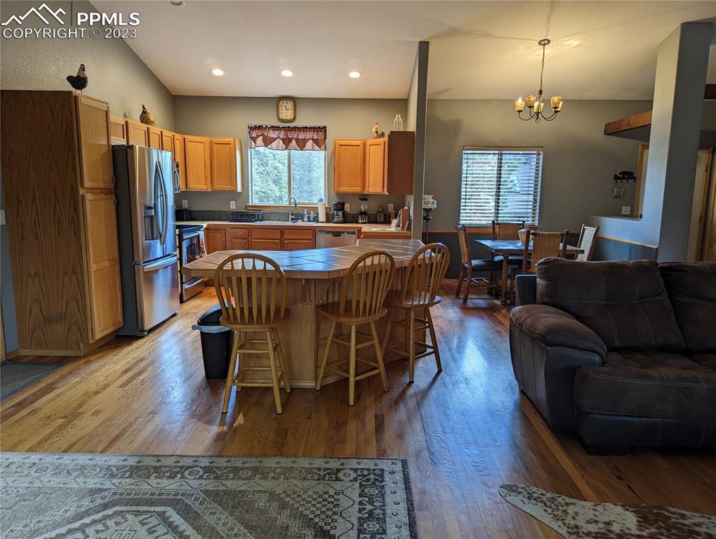 238 Aspen Circle Divide, CO 80814 - Photo 25 of 42 a view of a a dining room with furniture window and wooden floor