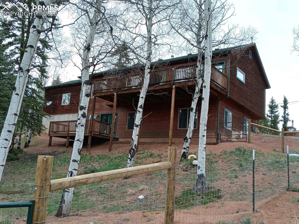 238 Aspen Circle Divide, CO 80814 - Photo 3 of 42 a front view of a house with garden